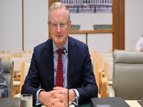 RBA boss defends interest rate hikes at inquiry hearing