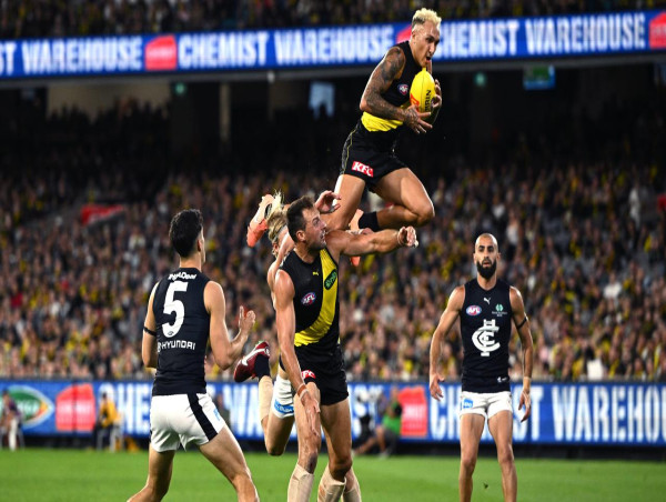 Lynch goal seals draw in Tigers-Blues AFL season opener