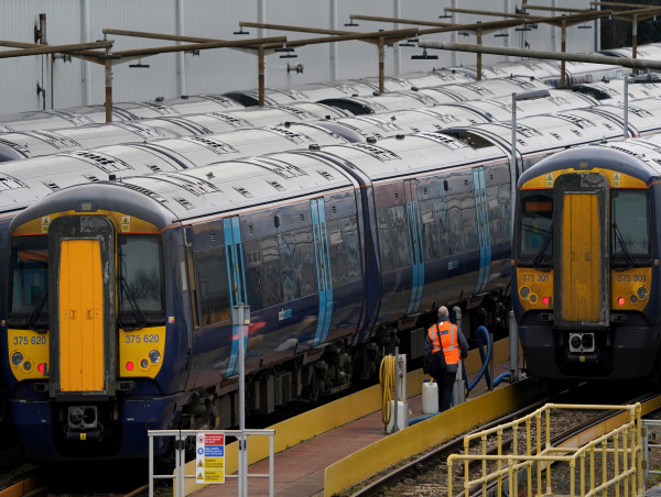  Train passengers face disruption as rail workers strike in pay and jobs row 