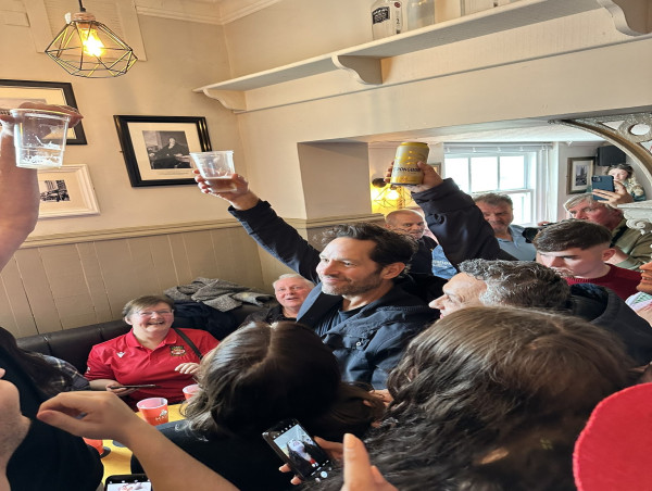  Paul Rudd drinks beer and sings chants with fans at Wrexham pub 