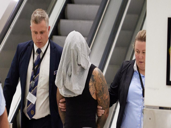 Man charged over alleged role in drive-by shooting