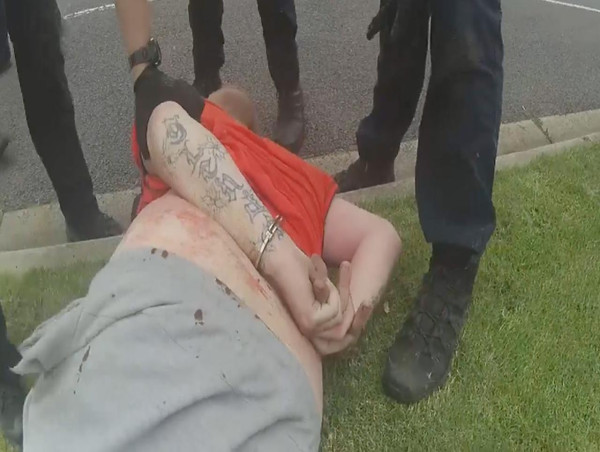 Man jailed for driving into and assaulting police