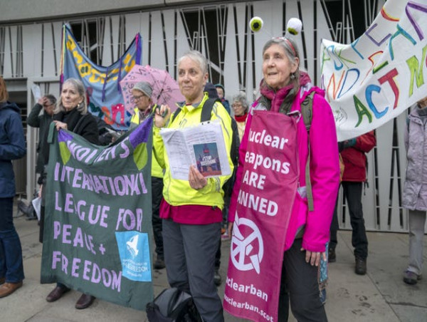  Two arrested after climate protesters throw red paint onto Scottish Parliament 