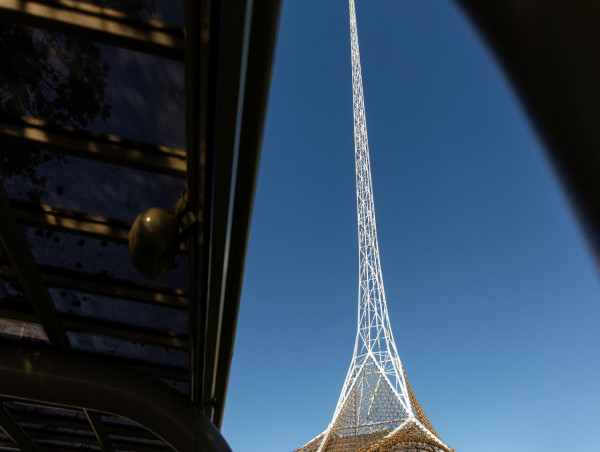 Activist climbs Arts Centre spire in climate protest