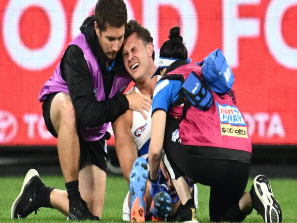  Comben stretchered off as Demons belt Kangaroos 