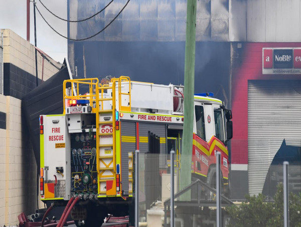 Firefighter dies after battling factory blaze