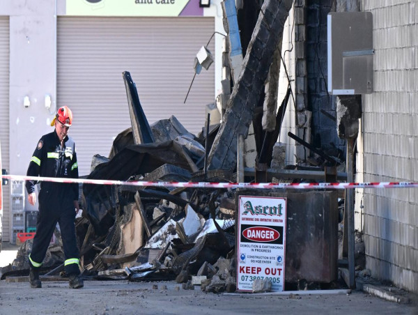  Firefighters mourn colleague as factory blaze probed 