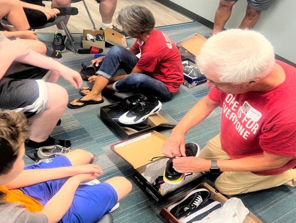  Community rallies around students in need and donates 100's of pairs of new gym shoes. 