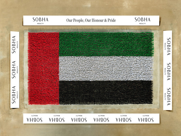 Sobha Realty achieves Guinness World Records™ title with “largest helmet mosaic formed by people” depicting UAE flag 