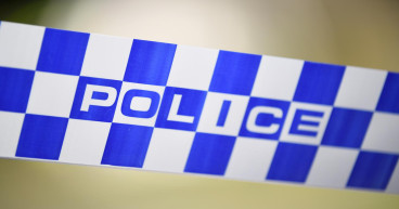 Woman with machete clears campsites