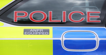 Police officer dragged along ground by car