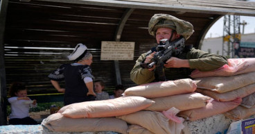  Defiant Jewish settlers march to evacuated West Bank outpost 