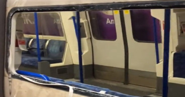 Passengers climb out of smashed windows at Tube station amid smoke emergency