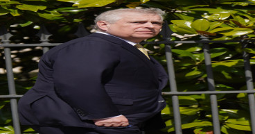 Duke of York booed as he is driven down The Mall for coronation