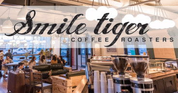 Happy Belly's Smile Tiger Coffee Roasters Signs 25-Unit Area Development Agreement in British Columbia