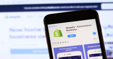Why is Shopify moving its listing from NYSE to NASDAQ important for investors?