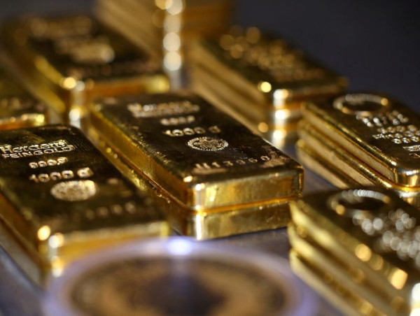 Gold dips as dollar ticks up on China COVID risks