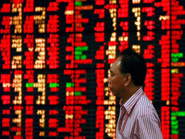 Stocks suffer biggest drop in two weeks; dollar gains on upbeat U.S. data