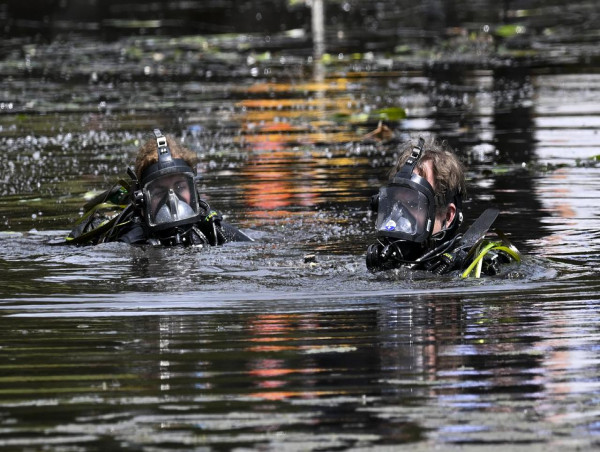 Divers Search Reservoir For Body In Drug Murder Probe