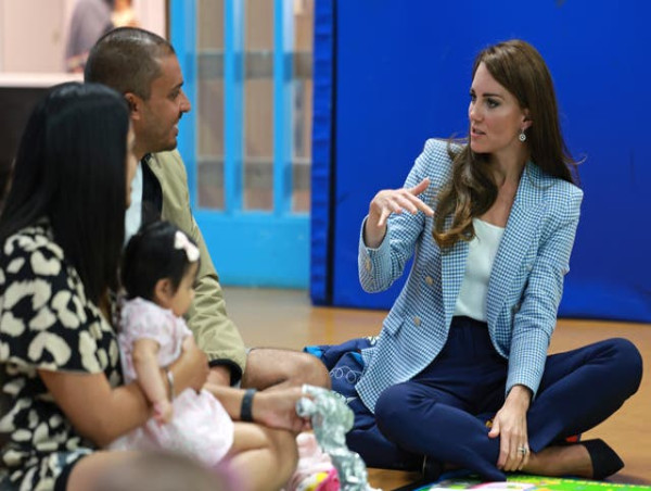 One-year-old baby takes toys from Kate at child support hub 