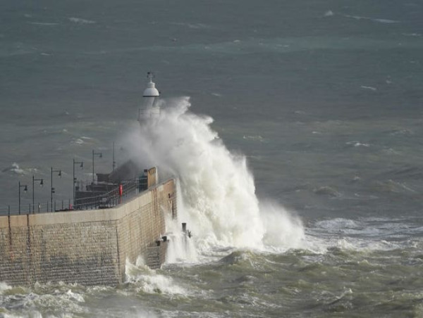 Storms batter southern England as flooding causes travel disruption