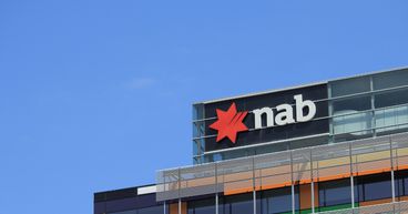 NAB (ASX:NAB) lifts 1H revenue, dividend; how are shares faring?