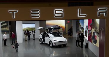 Tesla (TSLA) shares drop after announcing 3-for-1 stock split