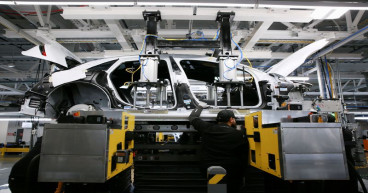 Electric vehicle makers burning cash, slammed by sky-high costs