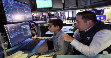 Wall Street mixed as Apple dips and traders eye Powell speech