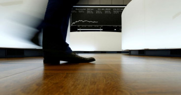 Global stocks to grind higher, lacklustre year ahead: Reuters poll