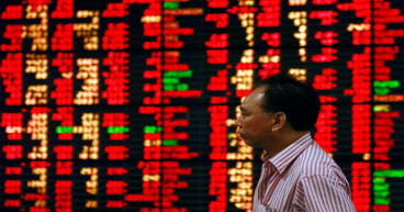 Stocks suffer biggest drop in two weeks; dollar gains on upbeat U.S. data