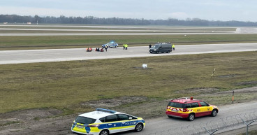 Climate activists glue themselves to airport tarmac in Berlin and Munich