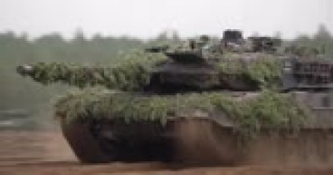 Tank maker Rheinmetall raises sales view, asks Berlin for firm orders