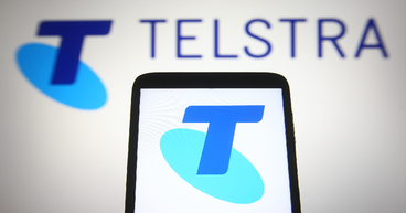 Why is telecom giant Telstra (ASX:TLS) in news?