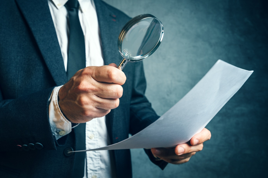 depicting investigating financial documents
