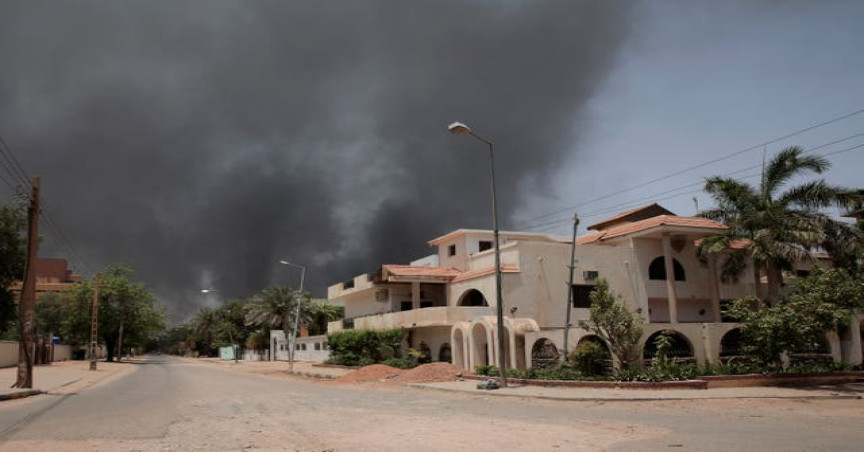 Smoke is seen rising from a neighbourhood in Khartoum, Sudan 