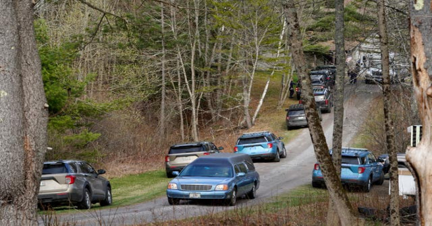 A hearse leaves the scene of a shooting on Tuesday, April 18, 2023, in Bowdoin, Maine