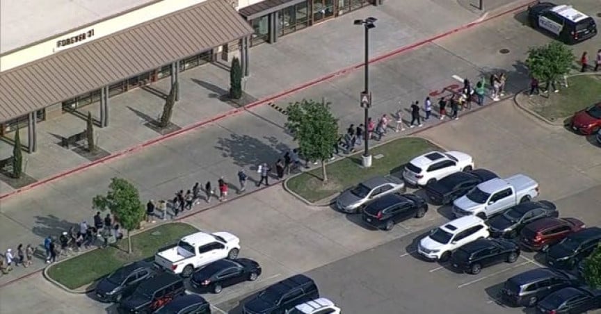 In this frame grab from video provided by WFAA, people are evacuated from Allen Premium Outlet, Saturday, May 6, 2023, in Allen, Texas. Law enforcement responded to reports of a shooting at the outlet mall, in the Dallas area