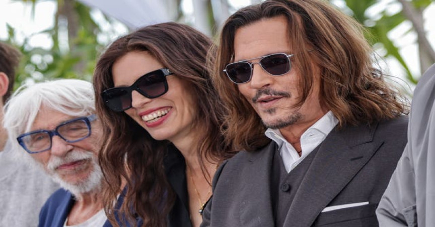 From left: Pierre Richard, director Maiwenn and Johnny Depp pose for photographers at Cannes