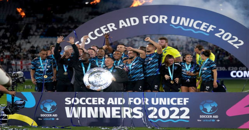 Rest of the World XI players celebrated with the trophy after the 2022 Soccer Aid for UNICEF match at The London Stadium, London