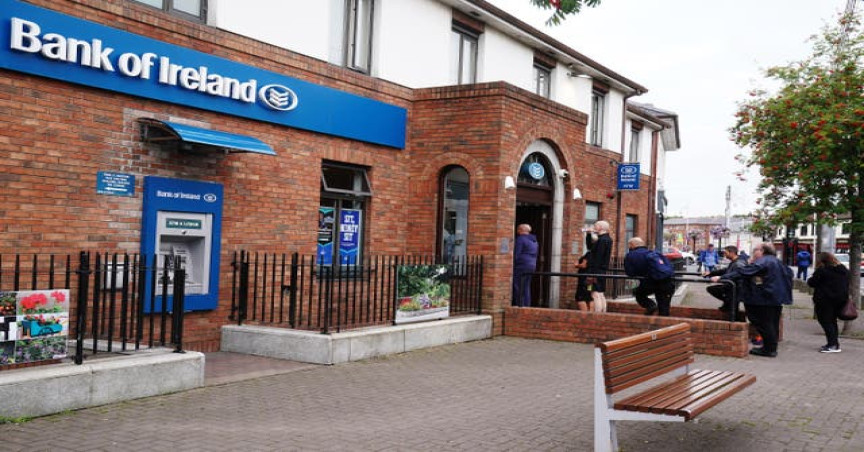 People queue to enter a Bank of Ireland branch in Dublin