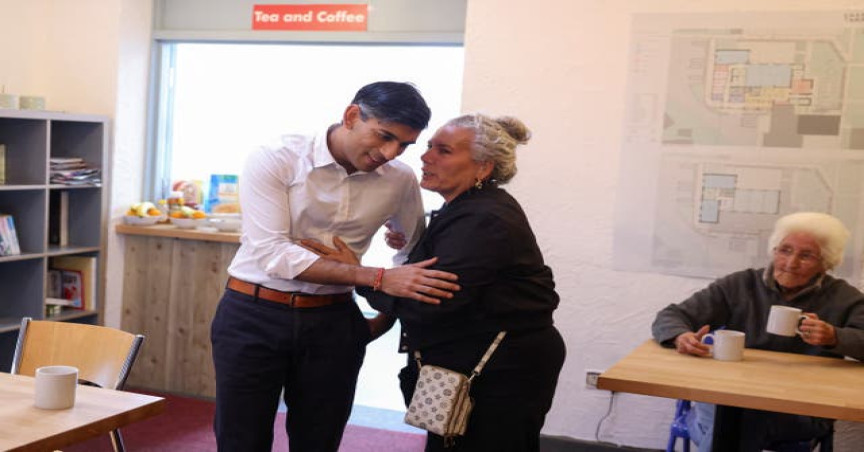 Prime Minister Rishi Sunak meets Christine Tadgell, 77, during a visit to Wormley Community Centre in Hertfordshire