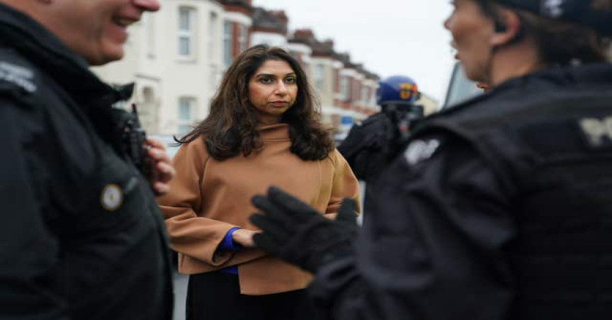 Home Secretary Suella Braverman attending a county lines raid with officers from West Midlands Police in October