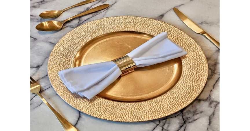Comet Gold Pebble Effect Charger Plate, £8; Pharaoh Gold Finish 16-Piece Cutlery Set, £34, Comet