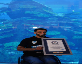 Faisal Al Mosawi Sets A New Guinness World Record for Fastest Dive with Underwater Wheelchair at Dubai Aquarium