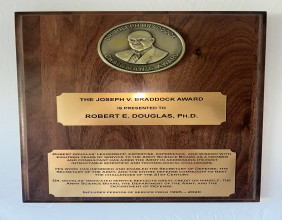 Dr. Robert Douglas is honored by the Army Science Board with the Dr. Joseph V. Braddock Award