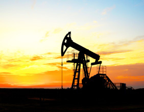 Oil prices slip over 1% on strong dollar, easing supply risks