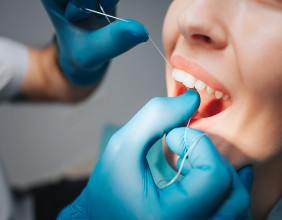 Dr. Chandler Goltz of Slidell Smiles Gives Insight on Traditional Floss Versus Water Flossers