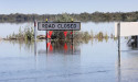 Outback town flood may peak below record