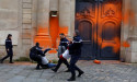  Climate activists spray-paint entrance to French PM's office 